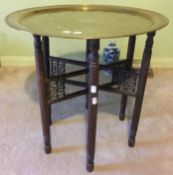 A brass top tray table