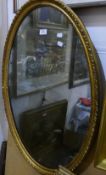 A Victorian gilt framed oval mirror