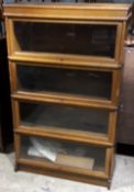 An oak four tier Globe Wernicke bookcase