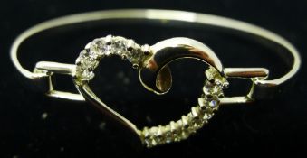 A silver heart bangle