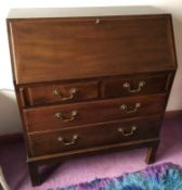 An early 20th century mahogany bureau