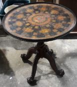 An unusual decoupage centre table,