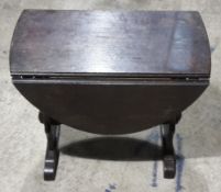 A small oak drop leaf coffee table