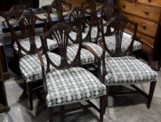 A set of eight Hepplewhite style dining chairs
