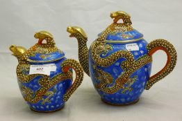 Two Japanese porcelain teapots decorated with dragons