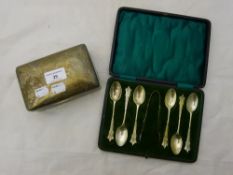 A silver cigarette box and cased silver teaspoons