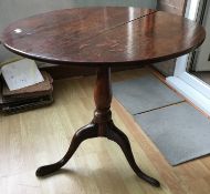 A George III oak tilt top tripod table