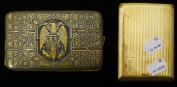 A gold plated cigarette case and a Russian cigarette case