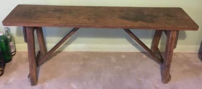 A late 19th/early 20th century oak bench