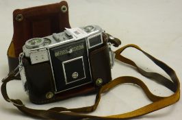 A cased Zeiss Ikon camera