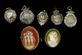 A quantity of silver fob medallions and two cameo brooches