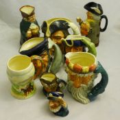 A collection of various Doulton Toby and character jugs