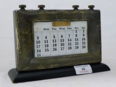 A silver mounted George V desk calendar