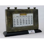 A silver mounted George V desk calendar