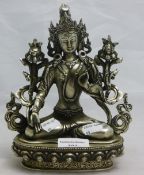 A silvered model of a seated deity