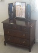 A Stag chest of drawers, a Victorian stick back armchair, a mirror, three raffia topped stools,