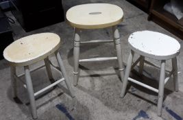 Four white painted stools