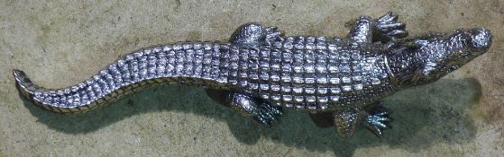 A silvered model of a crocodile