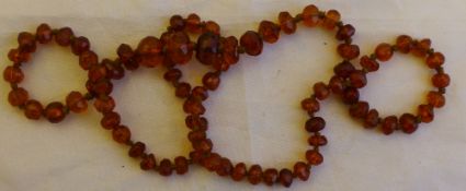 A string of faceted and graduated amber beads