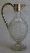 A Victorian hobnail cut glass claret jug with hallmarked silver mounts,