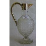 A Victorian hobnail cut glass claret jug with hallmarked silver mounts,