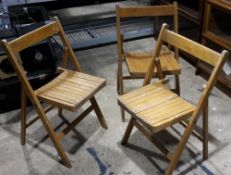 Three folding chairs