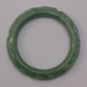 A carved jade bangle