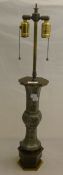A Chinese pewter lamp