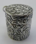 A silver embossed pill box