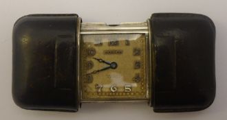 A Movado purse watch