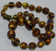 A Venetian Murano glass bead gold foiled necklace