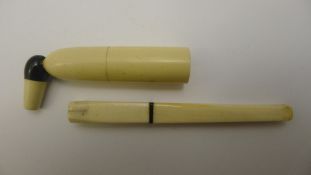 An Art Deco ivory cheroot holder and a needle case