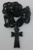 A mother-of-pearl inlaid cross and chain