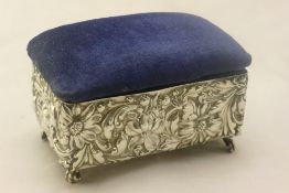 A silver velvet topped trinket box