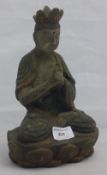 A small painted wooden Buddha