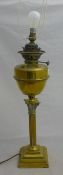 A brass oil lamp and another