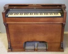 A Victorian walnut pedal organ