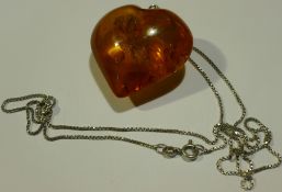 A heart shaped amber pendant