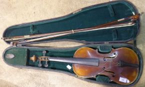 A cased violin and four bows