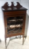 An Edwardian inlaid mahogany display cabinet