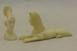 An early 20th century carved ivory sphinx and a carved ivory African head - WITHDRAWN