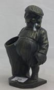 A bronze figure of a golfer