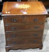 An inlaid chest of drawers