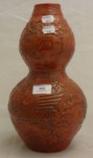 A Chinese red double gourd vase