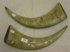 A pair of mother-of-pearl inlaid horns