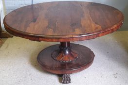 A 19th century rosewood circular tilt top breakfast table