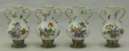 Four 19th century Continental silver mounted vases