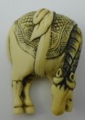 An 18th/19th century carved ivory netsuke formed as a horse