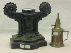 A single Victorian cast iron andiron/doorstop and a French oil lamp