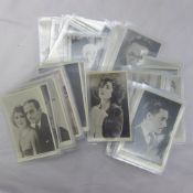 A quantity of postcards depicting classic film stars